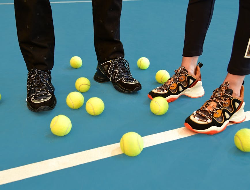 person human clothing apparel shoe footwear tennis sport sports
