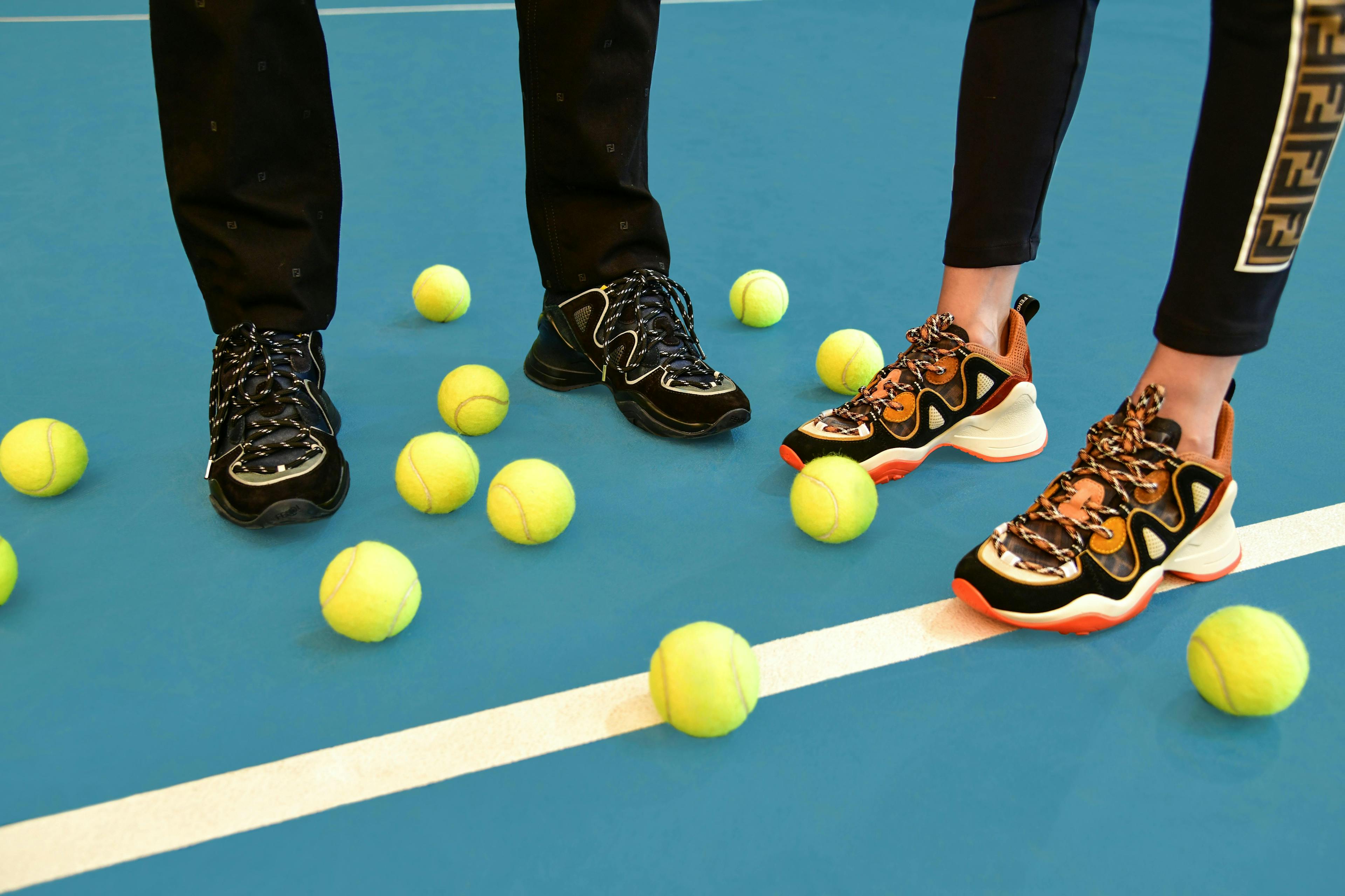 person human clothing apparel shoe footwear tennis sport sports