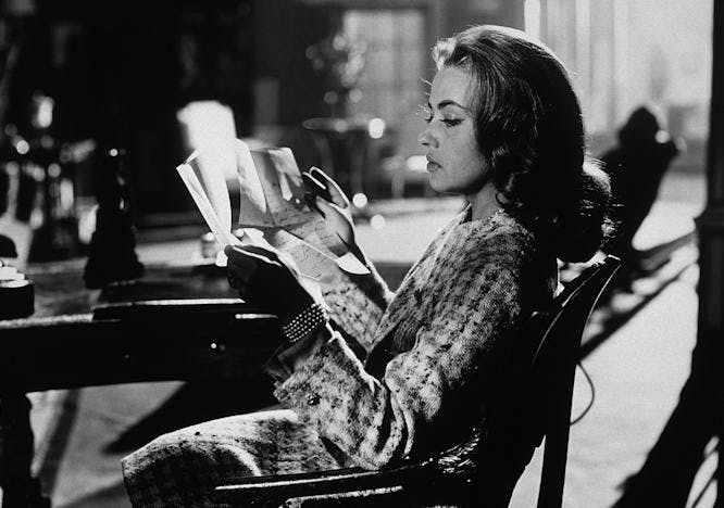 celebrities jeanne moreau people portrait prominent persons person human sitting musician musical instrument reading leisure activities