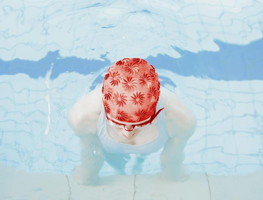 clothing apparel swimming sport sports water person bathing cap cap hat