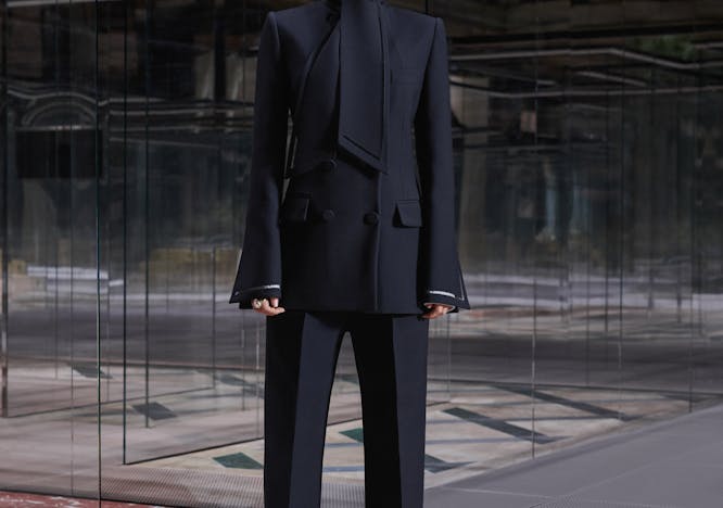 coat clothing apparel suit overcoat person human female tuxedo man