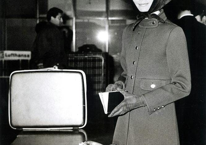 clothing apparel person human overcoat coat monitor electronics screen display