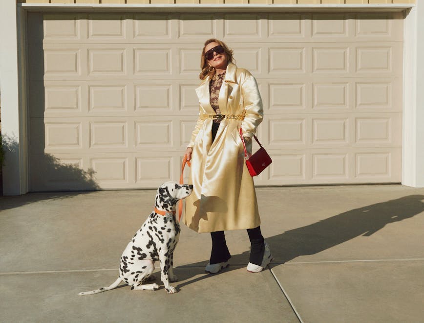 coat clothing apparel person human dog canine animal pet mammal